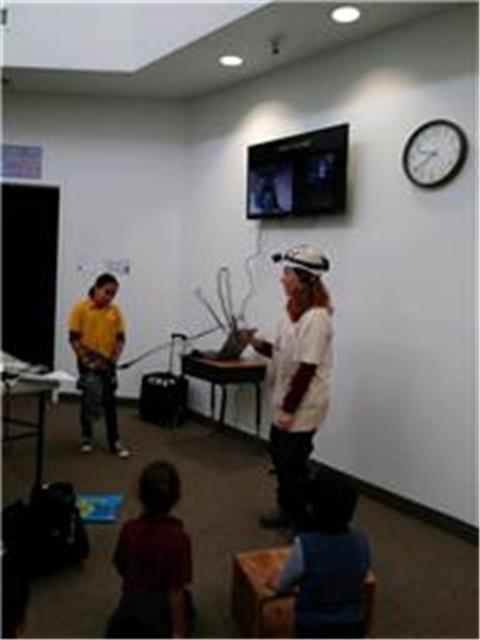 Visitor giving a presentation in front of the children