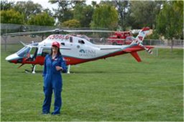 Woman in front of the helicopter